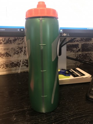 I use a 32 oz squeeze bottle. I follow a rule to drink 10 big gulps before you put it down. For me,