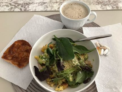 Breakfast for champs! Potato, onion, egg scrambler topped with avocado and cheese, and some greens.