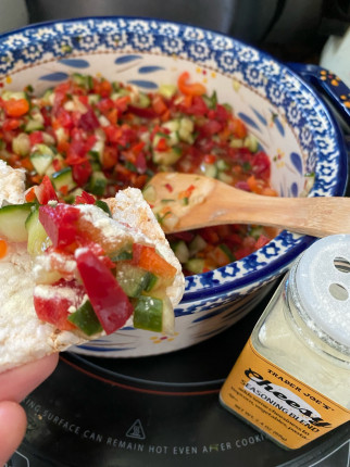 Diggin a chopped cucumber red pepper with lemon on puffed brown rice thins and a little cheesy seaso