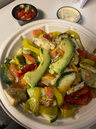 Super yummy fajita bowl with grilled chicken and a side of corn salsa and hummus from Crazy Bowls an