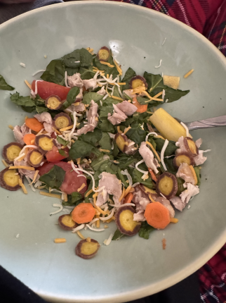 Today’s lunch :yum: Spinach salad with chicken, orange, white, & purple carrots, tomato, cheese,