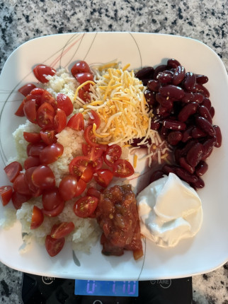 Today’s lunch. 4.5oz caulirice, 3oz tomato, 1.1oz salsa, 3.8oz beans, 2oz Greek yogurt, 1oz cheese.