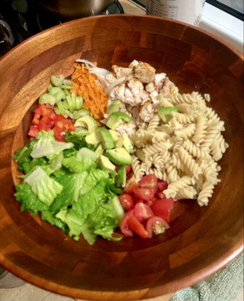 Topping this delicious salad with a spicy buffalo ranch dressing made with Greek yogurt.